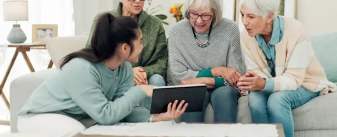 Senior and caregiver reviewing a checklist; text overlay reads “Top signs it’s time for memory care in North Palm Beach.